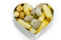 Multi Vitamin pills in heart isolated Royalty Free Stock Photo