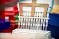 Multichannel pipette loading samples in pcr microplate with 96 wells Royalty Free Stock Photo