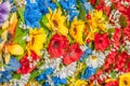 Multicolor artificial flowers, made of fabric, background, focus selection