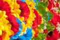 Multicolor artificial flowers, made of fabric, background, focus selection