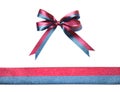 Multicolor blue-red fabric ribbon and bow isolated on a white background Royalty Free Stock Photo