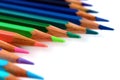 Bright color pencils diagonal wave on white background with green pencil on focus Royalty Free Stock Photo