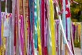 Multicolor bright ribbons hanging outdoors, can be used as a background or decor