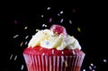 Multicolor candy topping pouring on strawberry delicious cupcake muffin in sugar temptation concept