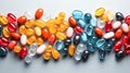 Multicolor capsules and pills on the white surface. Top view Royalty Free Stock Photo