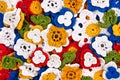 Multicolor crocheted flowers background