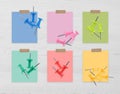 Multicolor drawing pins and cards of similar shades on white wooden background, collage. Montessori method