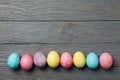 Multicolor Easter eggs on grey background, space for text Royalty Free Stock Photo