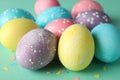 Multicolor Easter eggs on mint background Royalty Free Stock Photo