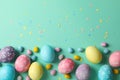 Multicolor Easter eggs on mint background Royalty Free Stock Photo