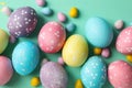 Multicolor Easter eggs on mint background Royalty Free Stock Photo