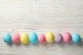 Multicolor Easter eggs on rustic background, space for text Royalty Free Stock Photo
