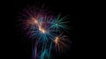 Multicolor fireworks explosion in night black sky.