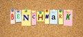 Multicolor notes with letters pinned on a cork board. Word BENCHMARK Royalty Free Stock Photo