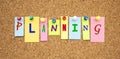 Multicolor notes with letters pinned on a cork board. Word PLANNING Royalty Free Stock Photo
