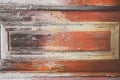 Multicolor old wooden texture background. Scratched weathered wooden door detail with peeled off paint Royalty Free Stock Photo