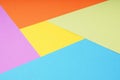 multicolor paper background with 5 different colors in triangle and rhombus shapes