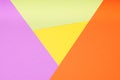 multicolor paper background with 4 different colors in triangle and rhombus shapes