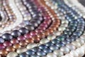 Multicolor Pearl Strands in parallel waves backlit composition Royalty Free Stock Photo