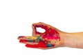 Multicolor powdered paints on palm. Concept of Holi, Indian spring festival. Female hand makes ok, isolated on white background,