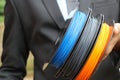 Multicolor printer filament spools made from thermoplastic which is from renewable sources usage encouragement concept by man in