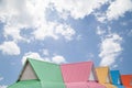 Multicolor roof on blue sky background .