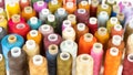 Multicolor sewing threads in assortment, background texture