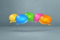 Multicolor speech bubbles on grey background Royalty Free Stock Photo