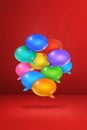 Multicolor speech bubbles on red vertical background Royalty Free Stock Photo
