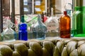 Multicolor vintage bottles on a windowsill. Royalty Free Stock Photo