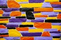 Multicolor violet and orange brick wall