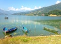 Multicolore tourist boats of Lake Pheva and mountains Royalty Free Stock Photo