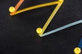 Multicolored abstract connected lines with pins on black background, connection and communication concept. Royalty Free Stock Photo