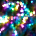 Multicolored abstract shiny background with bokeh, defocused Christmas lights. Festive concept. Selective focus. Royalty Free Stock Photo