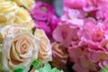 Multicolored artificial rose flowers for gift wrapping. Focus on the foreground.