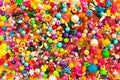 Multicolored beads background. Mix of shiny different size, shape jewelry glass and plastic bead Royalty Free Stock Photo