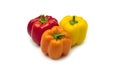Multicolored bell peppers on a white background. Red, orange and yellow bell peppers. Royalty Free Stock Photo