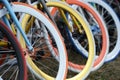 Multicolored bicycle wheels closeup