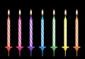 Multicolored birthdays candles isolated on black background