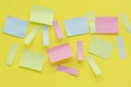 Multicolored blank paper stickers of different colors on a yellow background Royalty Free Stock Photo
