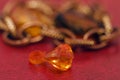 Multicolored blanks for beads close-up. Macro photo on a red background