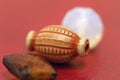 Multicolored blanks for beads close-up. Macro photo on a red background