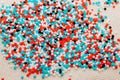 Multicolored blue, white, red beads close up. Royalty Free Stock Photo