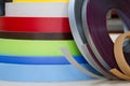 Multicolored bobbins of PVC edge and melanin for the manufacture of furniture. Lie pyramid. Royalty Free Stock Photo