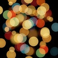 Multicolored bokeh circles create an abstract effect against a dark Royalty Free Stock Photo