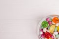 Multicolored bonbon sweets in glass bowl.