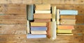 Multicolored books, flat lay, on wooden background, reading, education, literature,learning Royalty Free Stock Photo