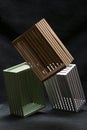 Multicolored boxes made of wooden slats on a dark background Royalty Free Stock Photo