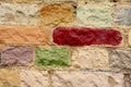 Multicolored brick wall. Texture of vivid wall of bricks. Close up. Concept of background for your text. Royalty Free Stock Photo