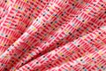 Multicolored bright cotton fabric with geometric shapes Royalty Free Stock Photo